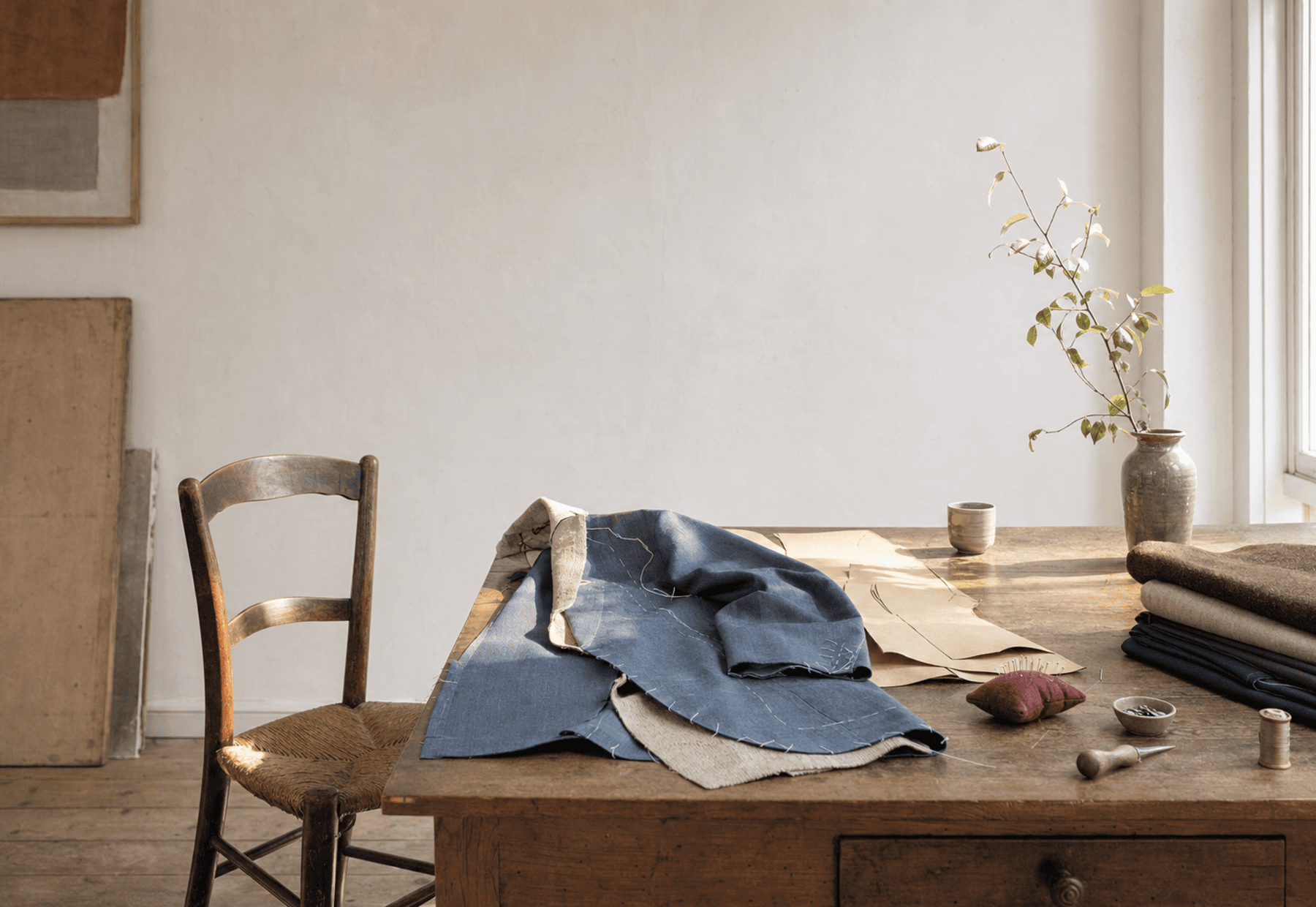 Tailoring worktable with pattern pieces and cloth